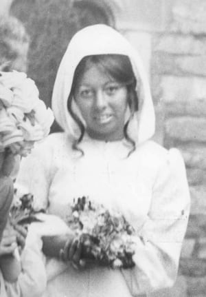 Lesley pictured as a bridesmaid at a wedding