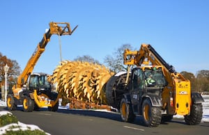 The sculpture being moved into place.