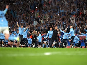 Pep Guardiola, centre, and Manchester City celebrate their Champions League win in 2023