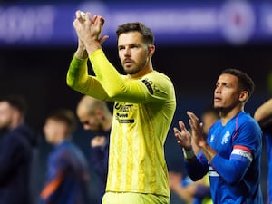 Rangers goalkeeper Jack Butland applauds the fans