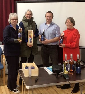 Mike Phillips, owner of Blue Moon Vineyards, with Howey WI members, from left, Lizzie Brailsford, Ruth Curzon and Kathryn Hunt (Image: Howey WI)