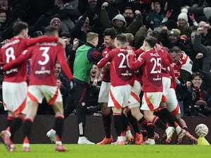 Manchester United players celebrate the late winner