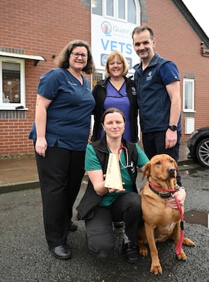 Celebrating the award win are (back row left to right): Lindsey Jones, vet and clinical director, Angie Davies, receptionist, and Neil Williams, vet and clinical director. Front: Rachel Swannick, deputy head nurse, with Reo the dog.