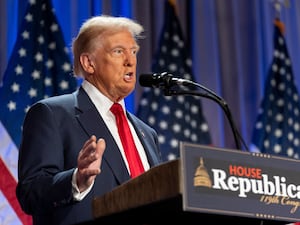 Donald Trump gestures while speaking