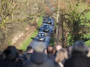 The funeral cortege of Peter and Loughlin Devlin arrives at the Church of St Joseph in Tynan