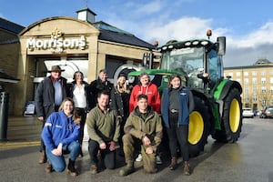 Tractor Tuesdays will see farmers given a quarter off all products in Morrisons cafes nationwide. They are pictured with Andy and Lynda Eadon.   