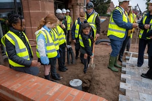 Pupils from Whitchurch Primary School burying the capsule