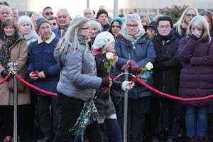 Members of the public lay flowers  to mark the 50th anniversary of Birmingham pub bombings