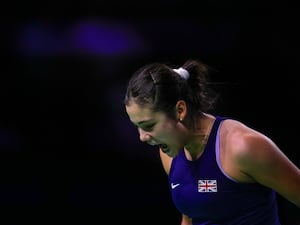 Emma Raducanu celebrates winning a point against Rebecca Marino