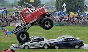 The Shropshire County Show 2018.  A monster truck jumping over cars