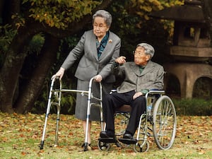 Japanese Prince Mikasa, right, and his wife Princess Yuriko talk at their residence in Tokyo in 2015