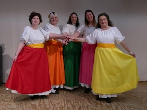 A group of the chorus girls in their colourful skirts. Image: Andy Compton