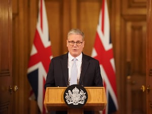 Keir Starmer stands at a lectern