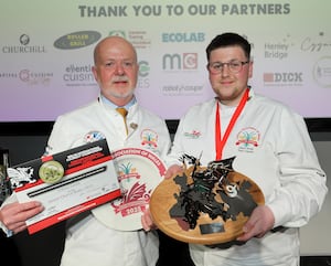 Calum Smith receives the Junior Chef of Wales trophy from Colin Gray, CAW chairman of judges. Picture: Phil Blagg