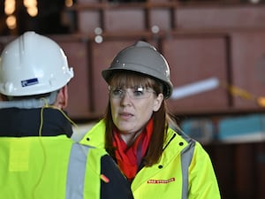 Angela Rayner, wearing hi-viz jacket, hard hard and safety glasses