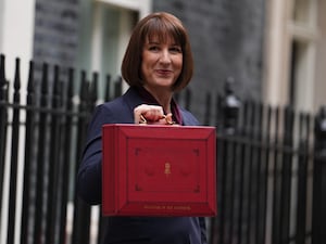 Chancellor Rachel Reeves holding a red box in Downing Street