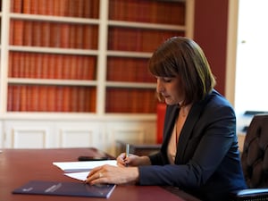 Rachel Reeves sitting at a desk