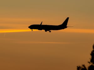 A plane against an orange sky