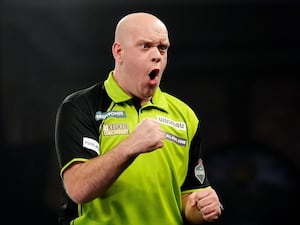 Michael van Gerwen celebrates on stage