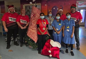 Members of a Knighton rugby team became Santa and provided a sack full of presents to children at Hereford Hospital over Christmas.