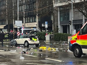 Emergency services attend the scene of an accident after a driver hit a group of people in Munich, Germany