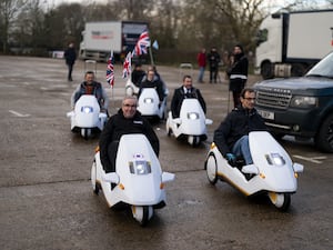 Sinclair C5 enthusiasts enjoy the gathering at Alexandra Palace in London