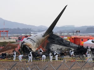 Rescue workers at the site of the crash