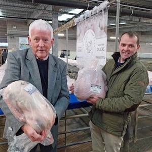 Show judge Alan Tomlinson and Shrewsbury Auction Centre manager Jonny Dymond with the best goose and heaviest turkey, respectively.