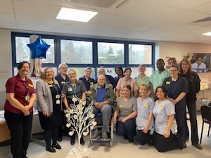 Members of the renal unit with patient Peter Downes, his wife and John Watts.