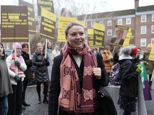 Supporters stand behind barrister Charlotte Proudman as she arrives at 9 Grays Inn Square, London, ahead of a misconduct hearing, where she is accused of professional misconduct by the Bar Standards Board over comments she made of a “boy’s club” attitude within the judiciary.