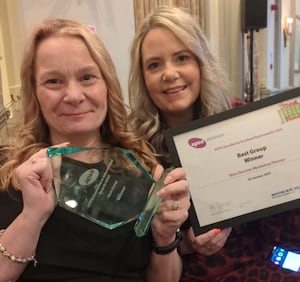 Susan Vuli and Lauren Moore from Shire Services with the award. 