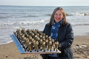 Tansy Forster with some of the knitted soldiers from The Longest Yarn on Utah beach.