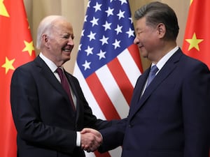 US President Joe Biden shakes hands with Chinese President Xi Jinping