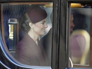 The Prince and Princess of Wales sit in a carriage after welcoming the Emir of Qatar and his wife to the UK