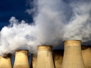 Smoke rising from power station towers