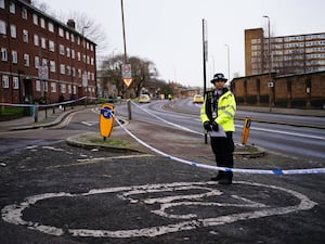 A police officer in Woolwich Church Street in Woolwich, south-east London, after the incident