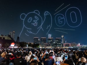 A giant panda in the night sky created by drones