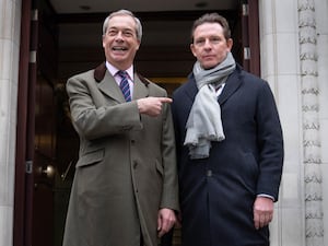 Nigel Farage pointing at Nick Candy