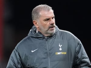 Tottenham boss Ange Postecoglou looks on as he stands on the touchline