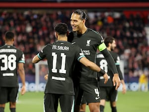 Mohamed Salah and Virgil van Dijk embrace