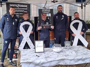 White Ribbon Day awareness raising at Bailey Head in 2023 with campaign supporters The New Saints FC.