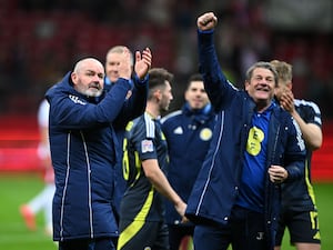 Steve Clarke, left, salutes the Scotland fans