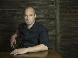 Donal Ryan sitting on a chair in a black shirt