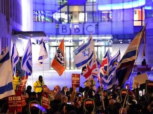 People with Israeli and British flags taking part in a protest outside the BBC’s Broadcasting House in central London