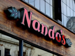 A sign saying Nando's above a branch