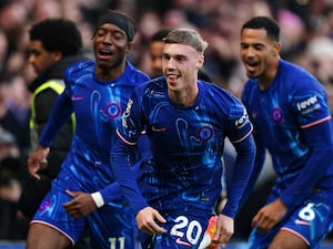 Cole Palmer celebrates scoring for Chelsea with team-mates behind him