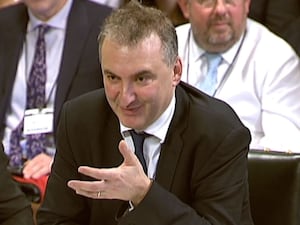 Sir Chris Wormald gives evidence to a Commons committee on the financial stability of the NHS in 2017