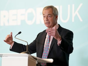 Nigel Farage gesturing as he makes a speech