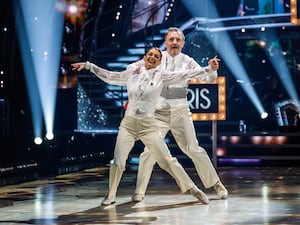 McCausland and Buswell performing their routine in matching white suits