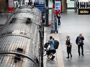 People getting on board a train